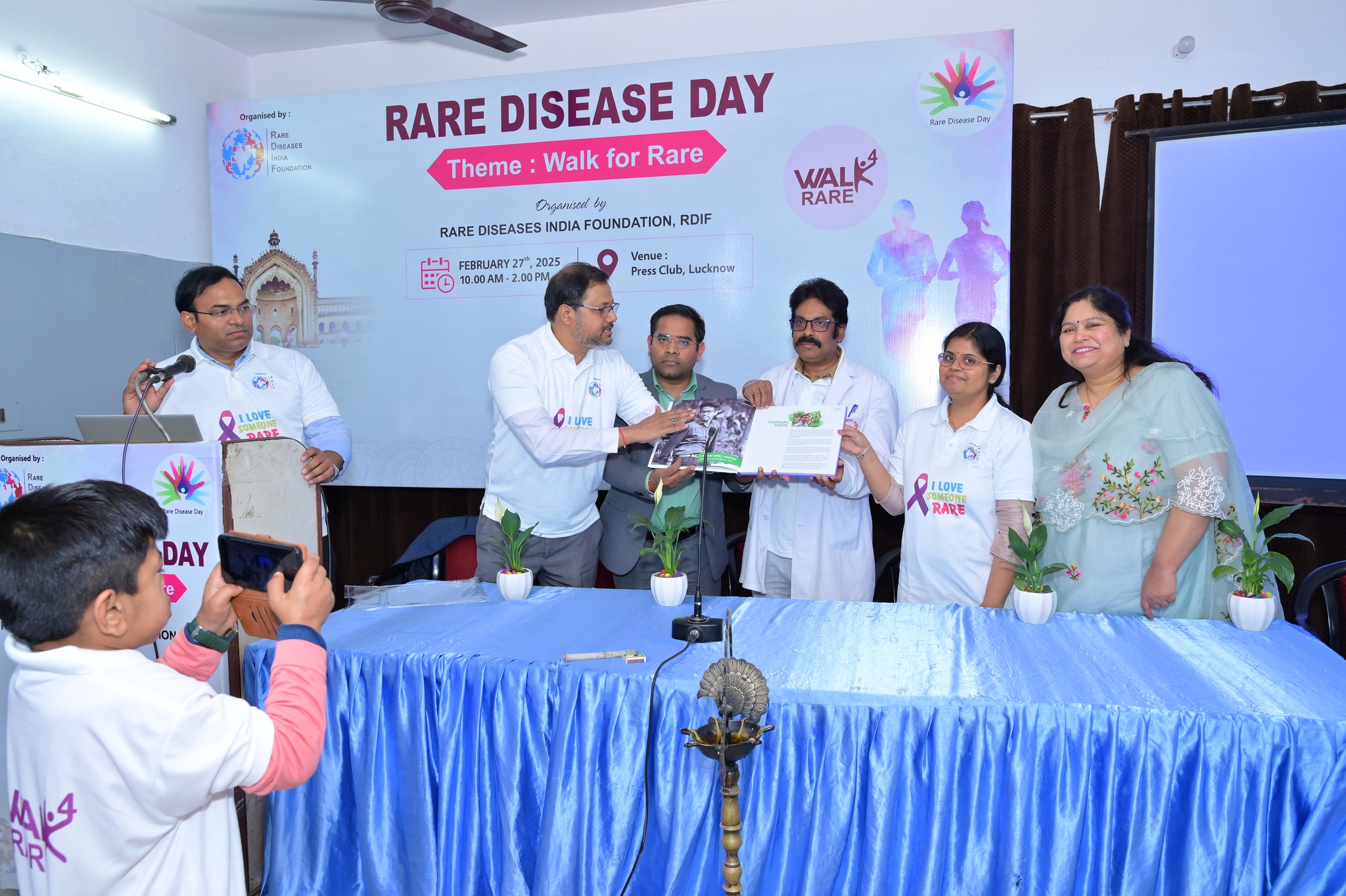 Audience members asking questions during a Q&A session.